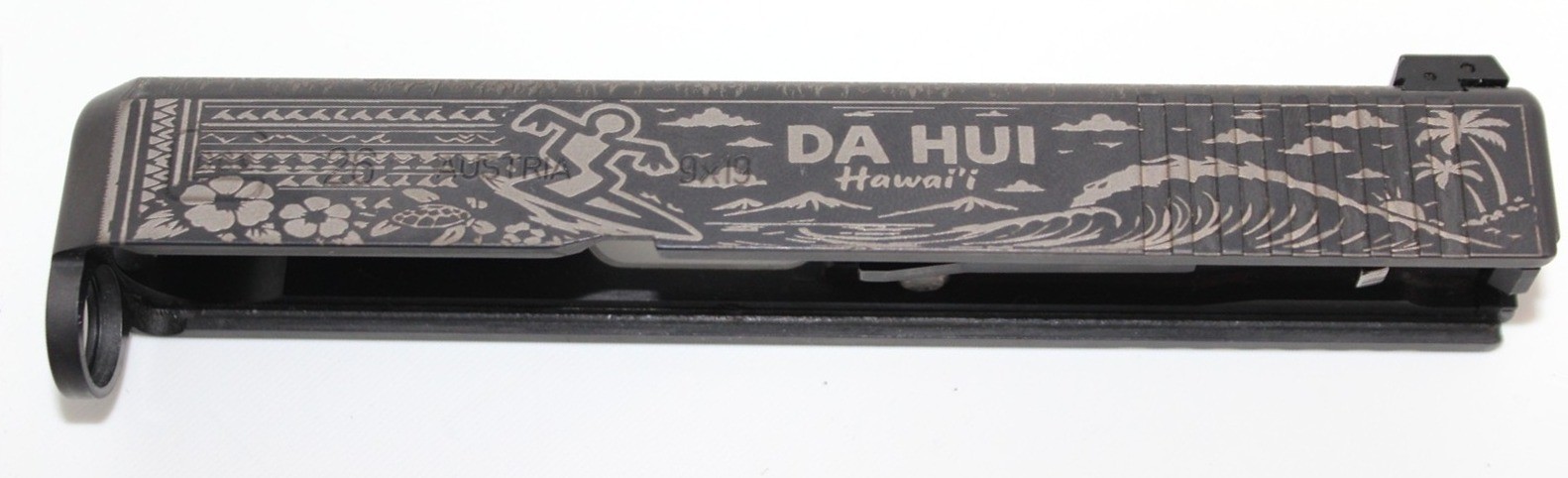 Da Hui Hawai'i design laser engraved on a Glock slide